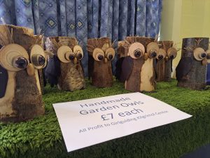 Multiple wooden Garden Owls with £7 price label