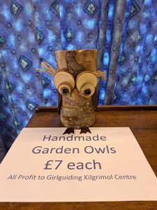 Handmade wooden owl with leather wings