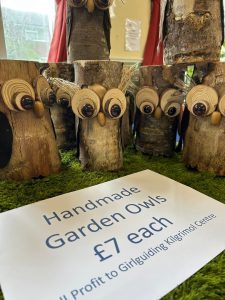 Group of handmade wooden garden owls
